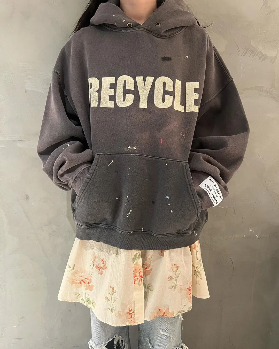 GALLERY DEPT. 90'S RECYCLE HOODIE WASHED BLACK 90'S washed hoodie with distressed eco-friendly slogans. Washed black S-XL. Ready-made garments are washed and dyed again. Multiple spots throughout the body are spray-faded. The ribs are cut and worn.